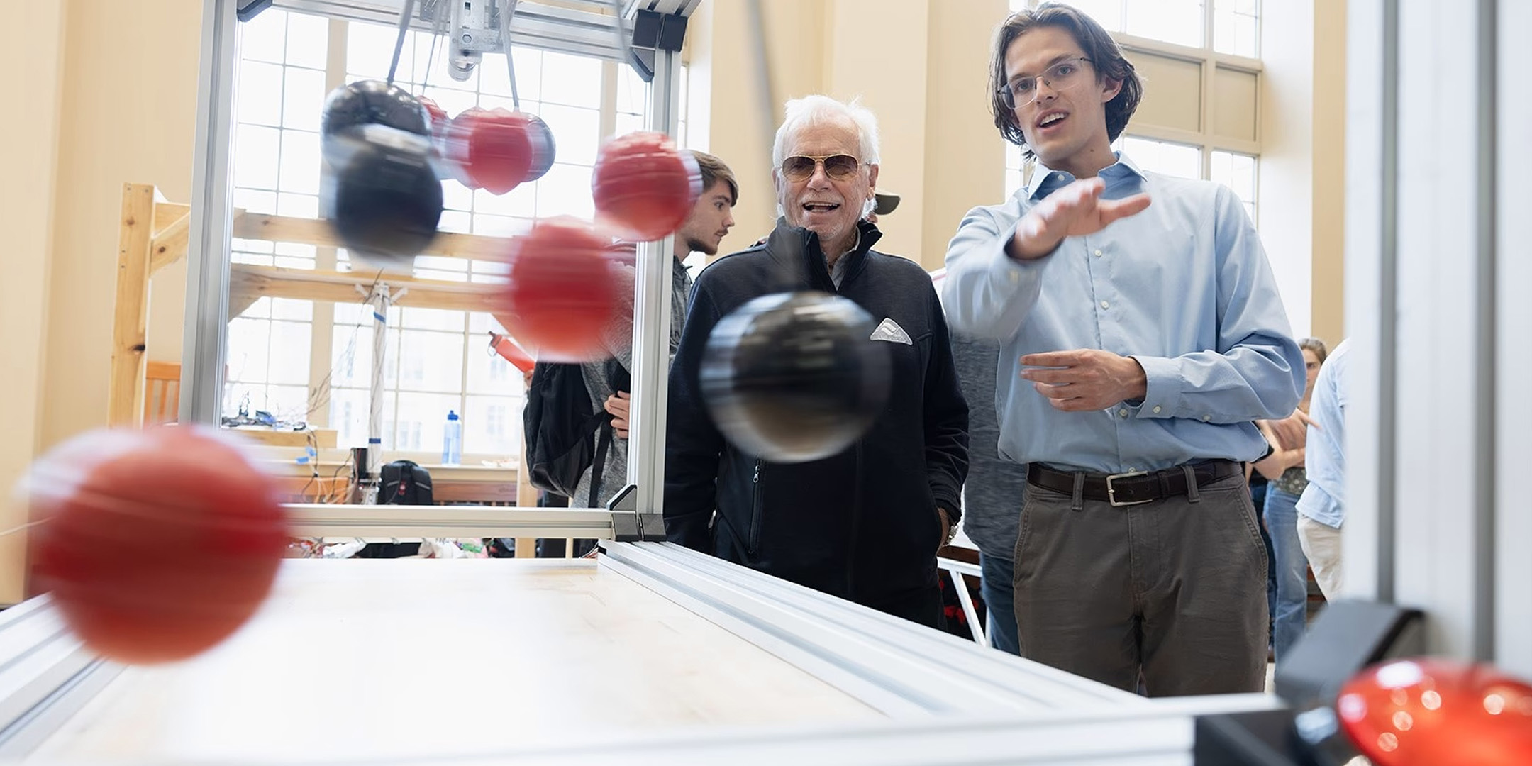 Bjorn Borgen with a student at the 2025 Mechanical Engineering Spring Design Showcase