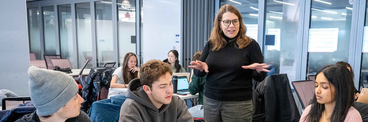 Person leading a meeting in a classroom