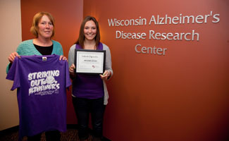 Ali Brems and her mother, Lori Brems, celebrate Ali's gift to the Alzheimer's Disease Research Center that will be used to screen older adults in senior centers who might not have family members who notice when memories are slipping.