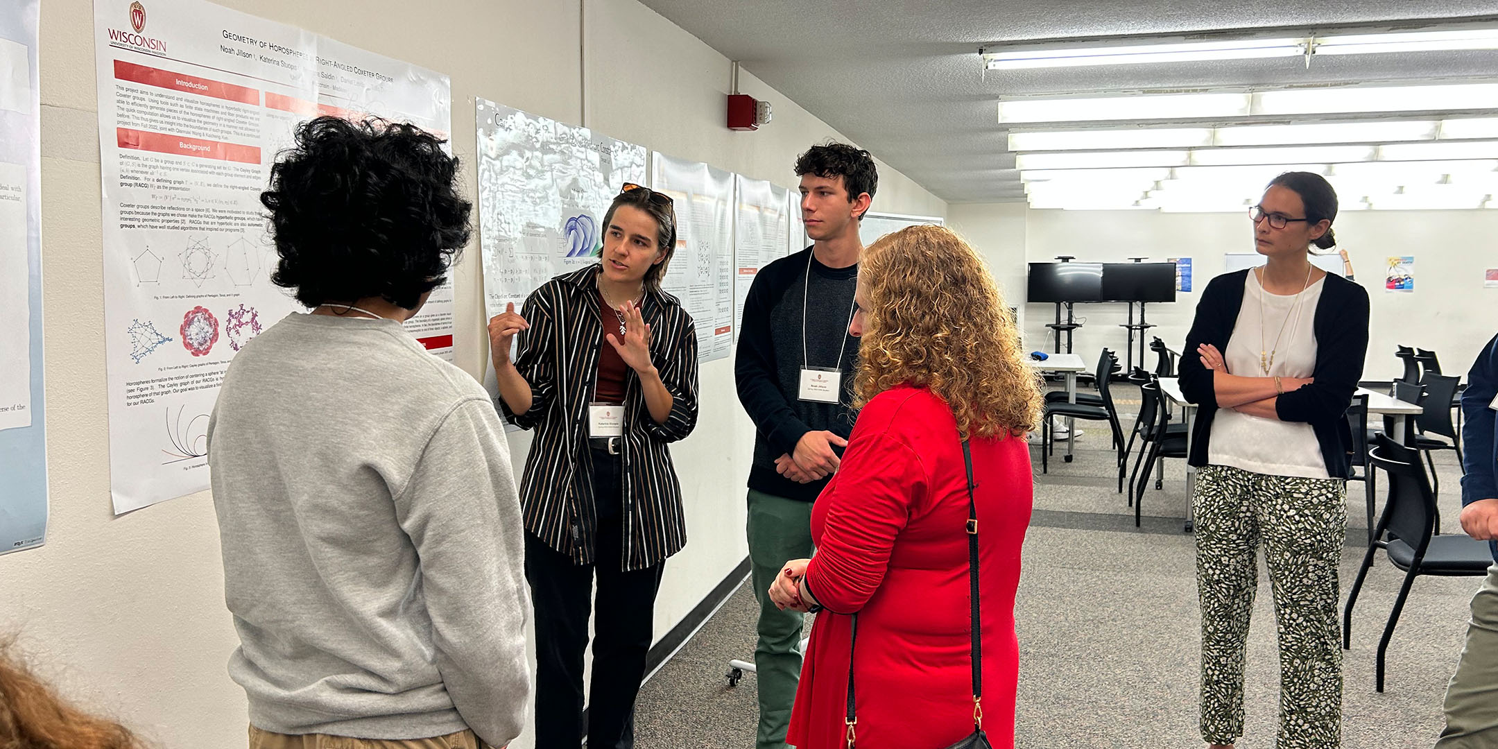 Chancellor Mnookin speaking with students about their projects.