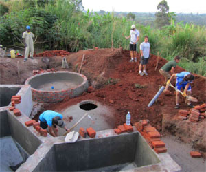 The crew including West Point cadets builds the digester.