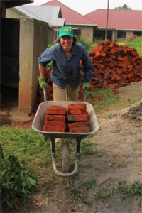 Team leader Aleia McCord moves bricks for the project.