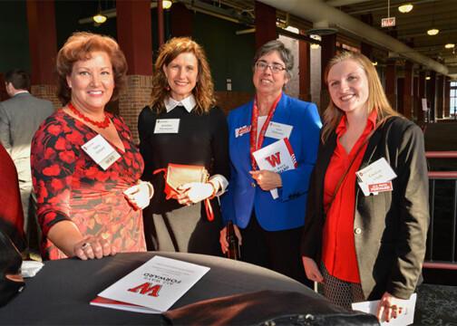 A group of attendees smiling