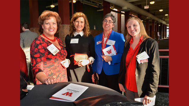 A group of attendees smiling