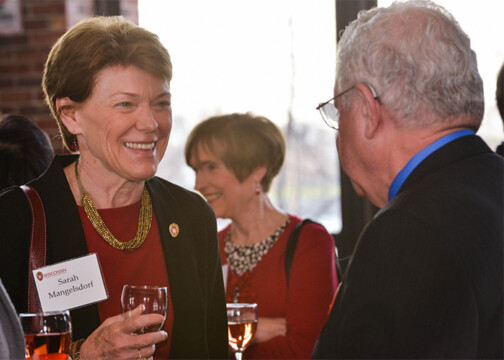 Attendees talking with each other