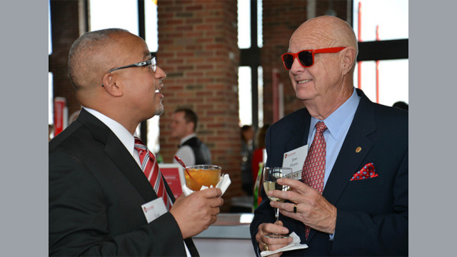 Lou Holland Jr and Jere Fluno talking