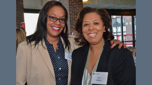 Two individuals smiling