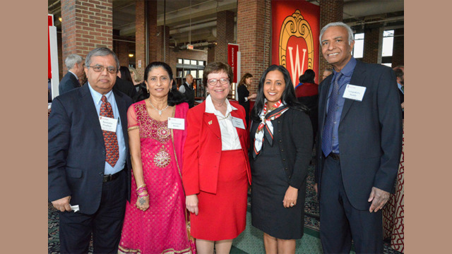 Chancellor Rebecca Blank with others smiling