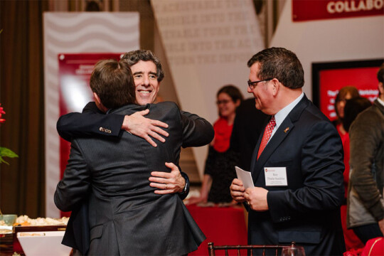 Doctor Davidson hugging a friend