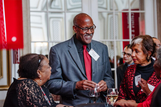 Attendees speaking with each other