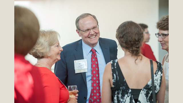 Attendees speaking with each other