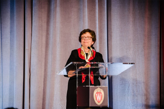 Chancellor Rebecca Blank speaking on stage