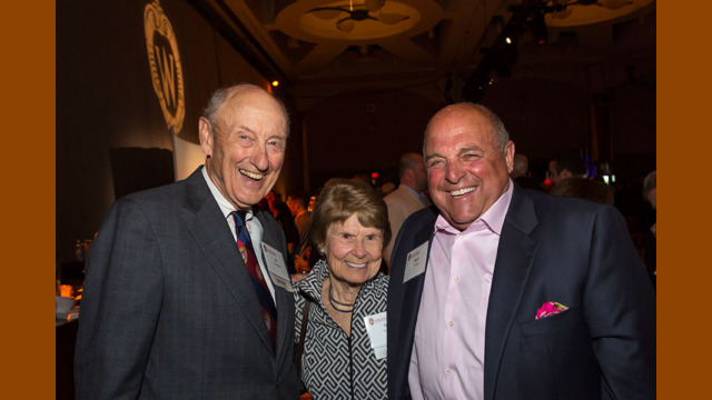 Attendees smiling for a photo