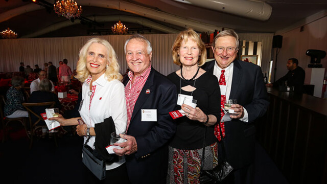 Attendees smiling for a photo