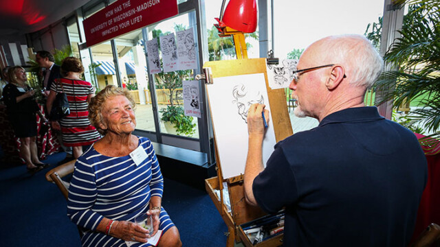 An attendee getting a picture drawn of them