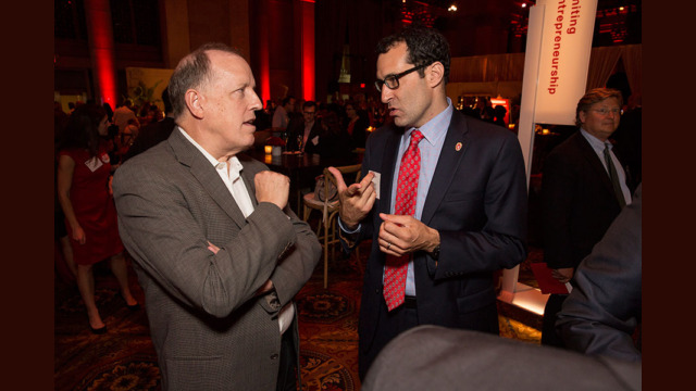 Attendees speaking with each other