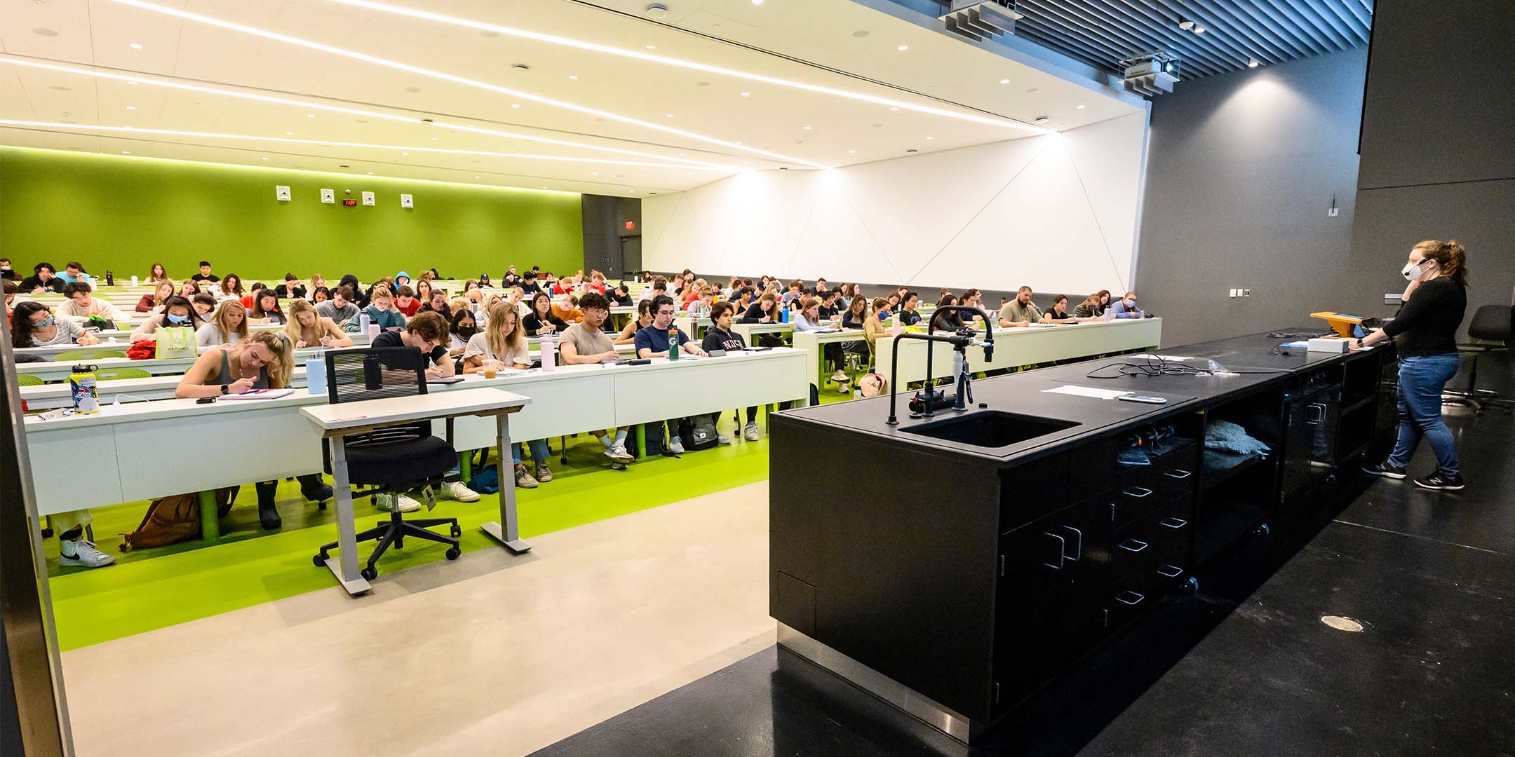 Aubrey Ellison, associate director of the organic chemistry labs, lectures on CHEM 345, the second semester of organic chemistry in lecture hall S413 of the new instructional tower addition to the Chemistry Building at the University of Wisconsin–Madison
