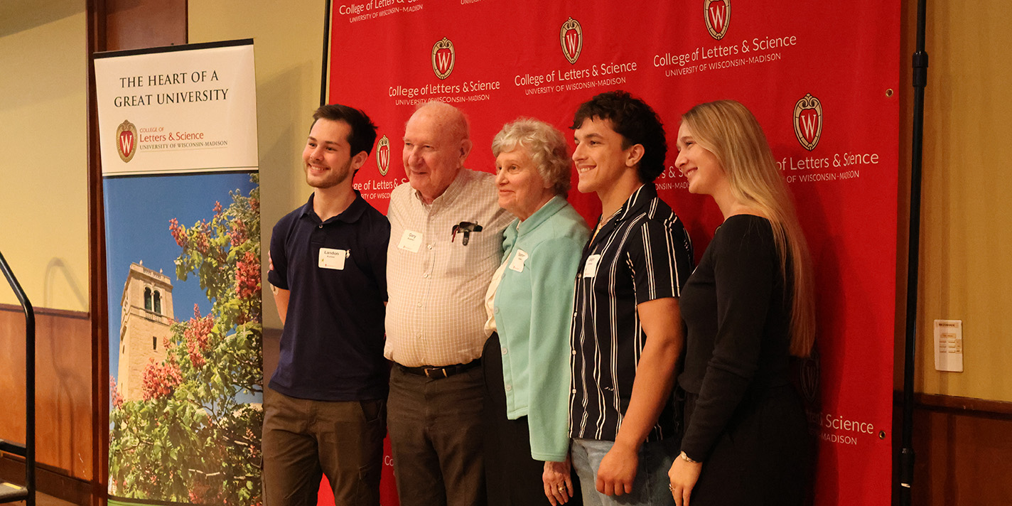 The Kramers pictured with students