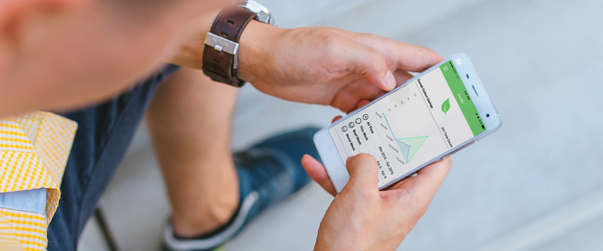 A person examining on their phone the app My Earth – Track Your Carbon Savings