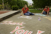 Students chalk a Bascom Hill walkway